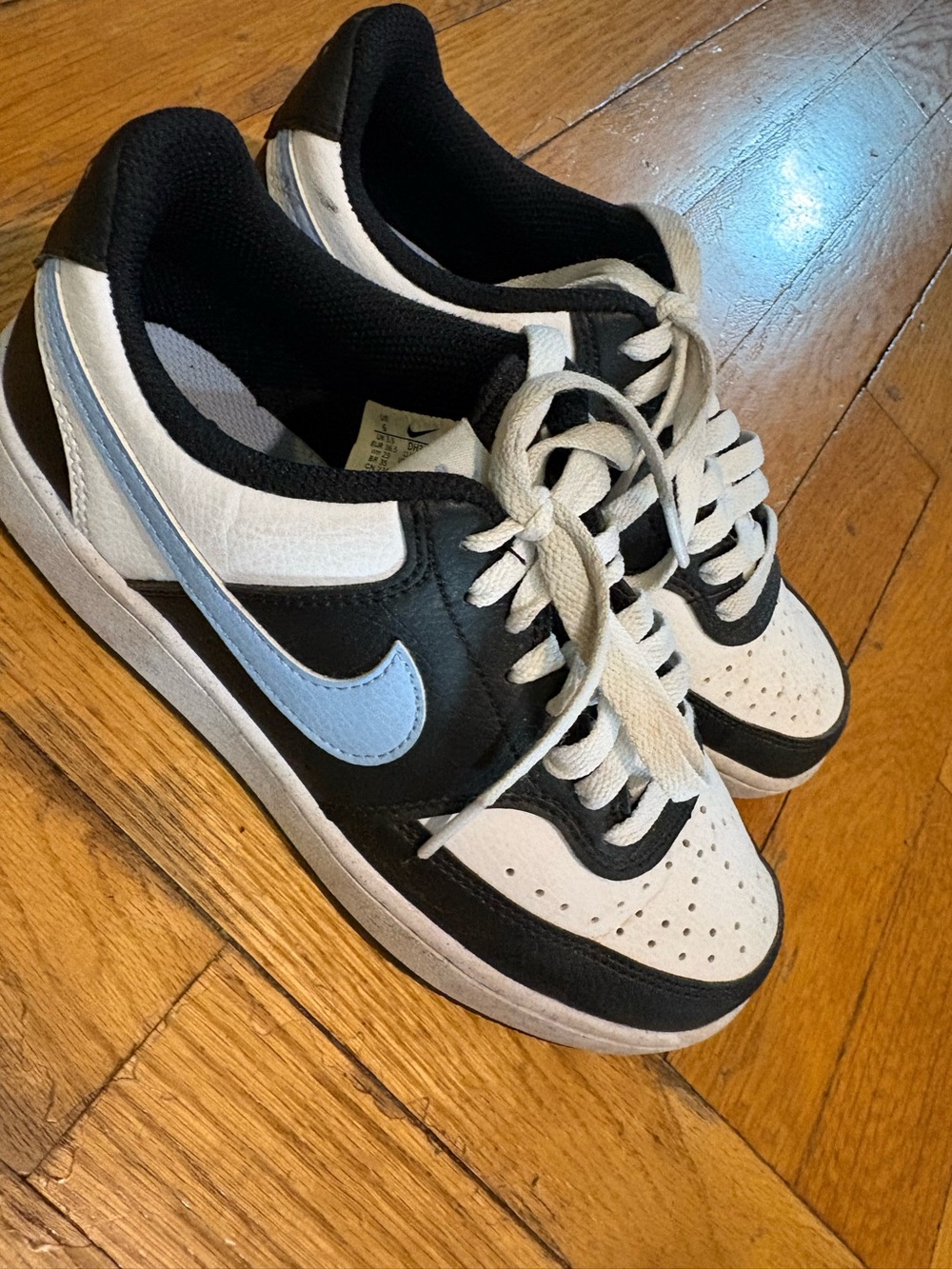 Nike Women’s Low-Top Sneakers in Black, White & Light Blue Swoosh